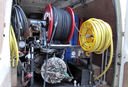 High pressure jetting hose reels mounted in the back of the van